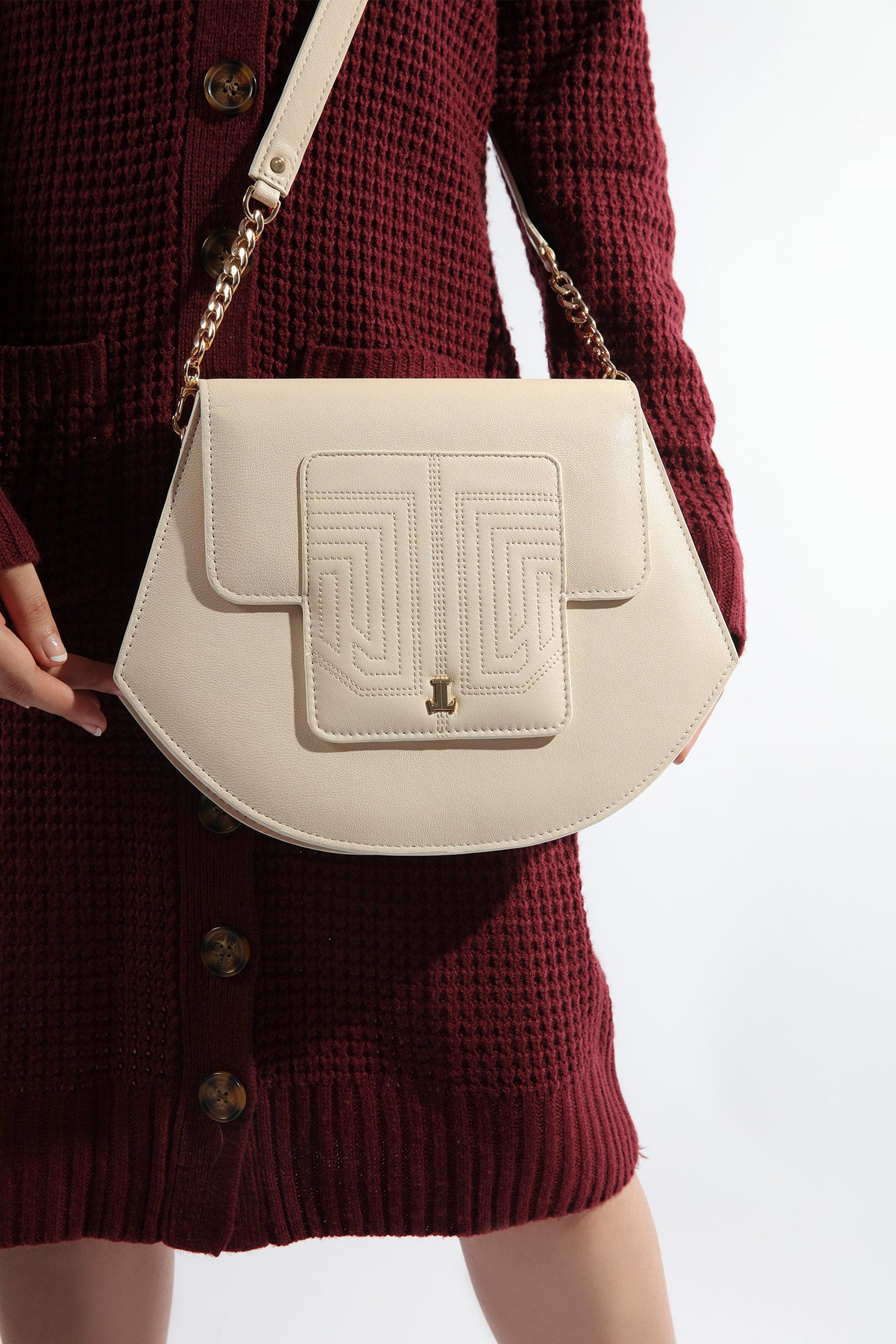 Womens leather shoulder bag in beige colour in accordion shape with quilting by JULKE