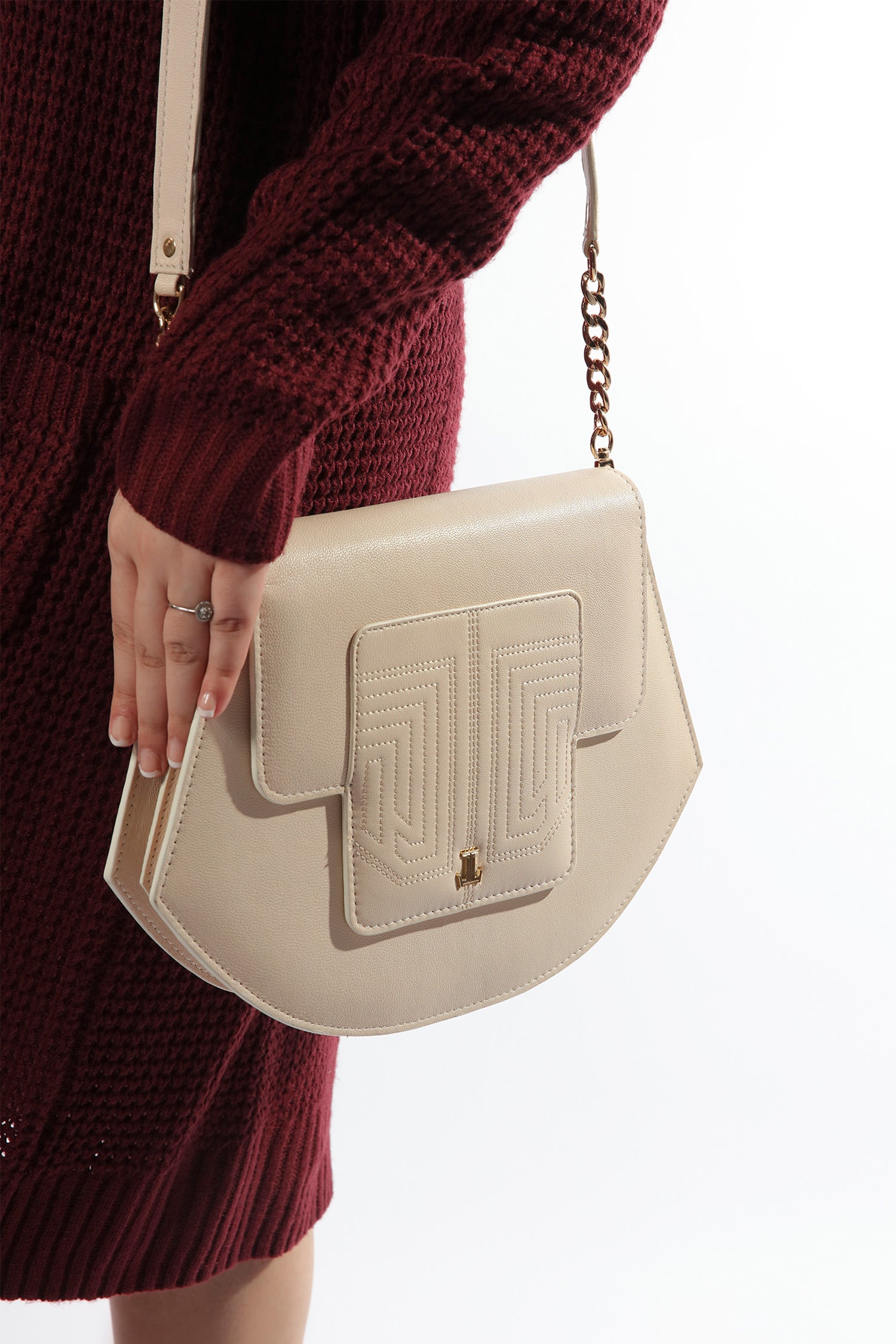 Womens leather shoulder bag in beige colour in accordion shape with quilting by JULKE