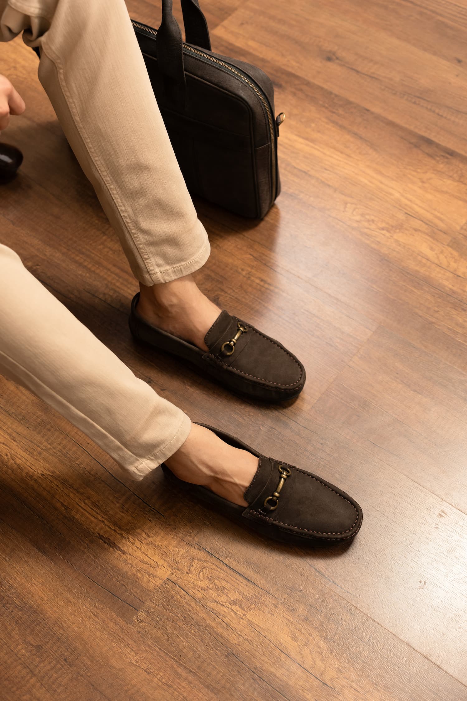 Mens suede leather moccasins in brown colour with metallic dull gold hardware by JULKE.