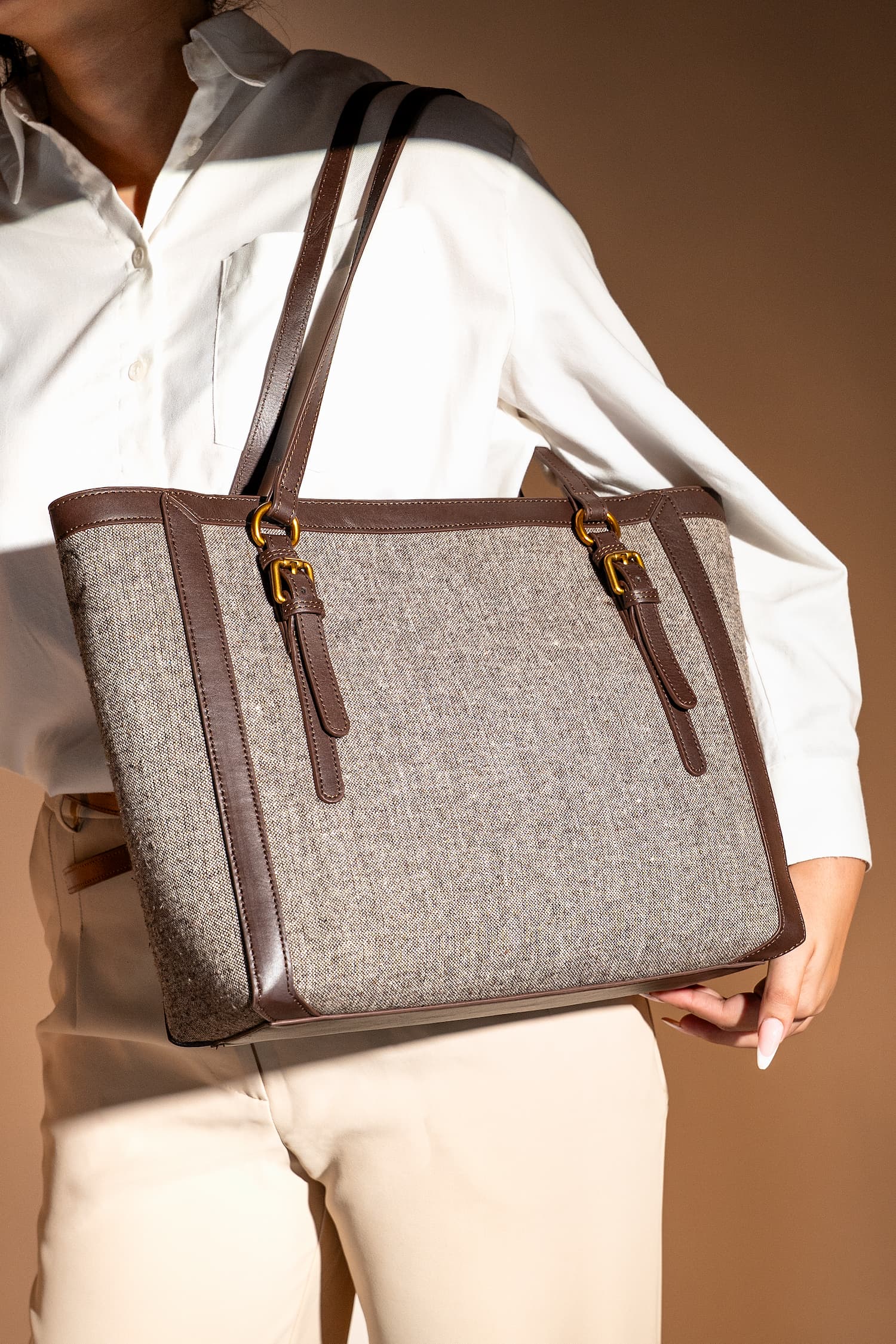 Women's leather & tweed shoulder tote bag in brown colour with removable inner suede pouch and metallic gold hardware by JULKE.