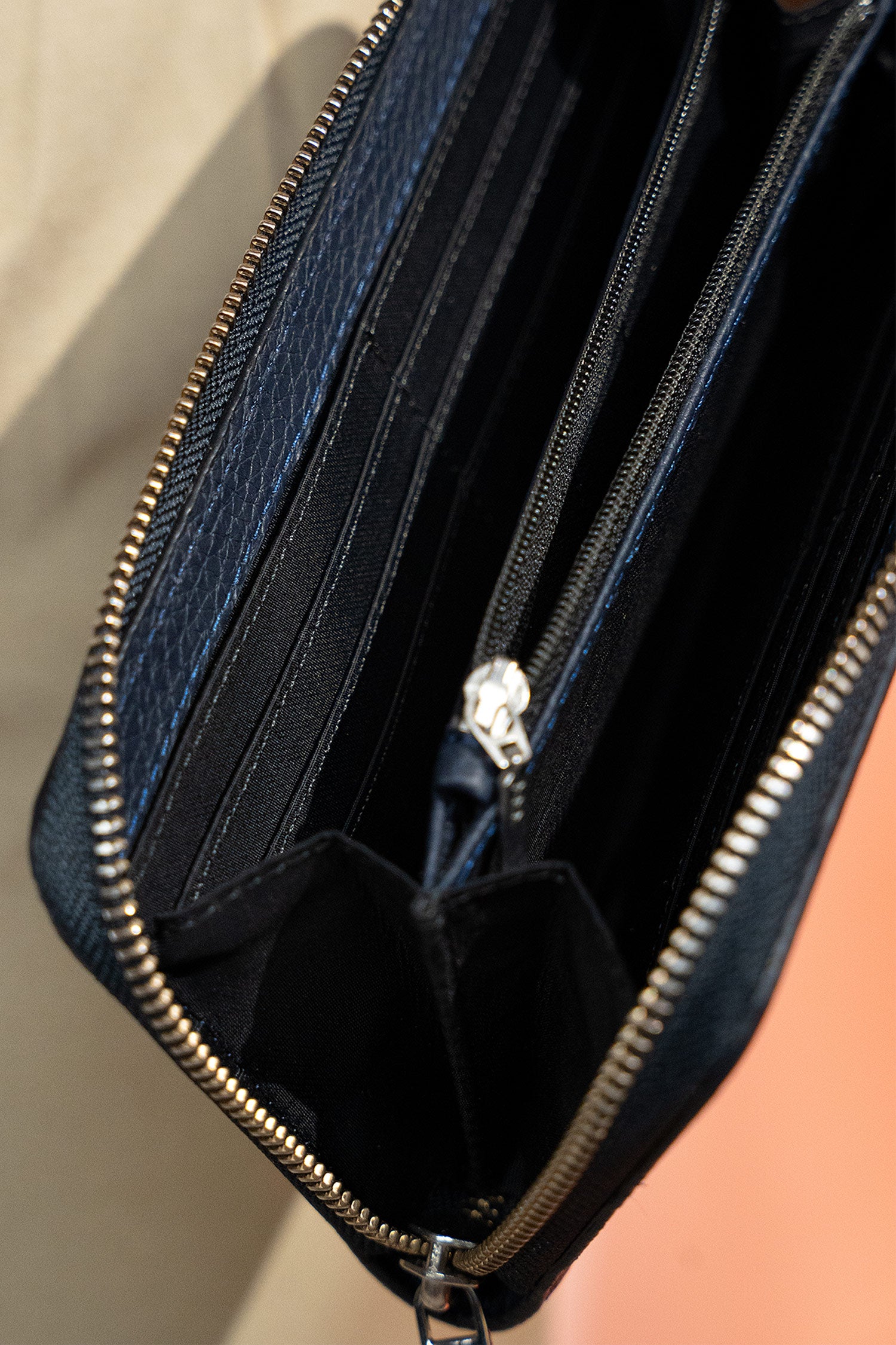 Women's leather long wallet in navy blue colour with zipper closure contrast stitch and metal brand logo by JULKE.