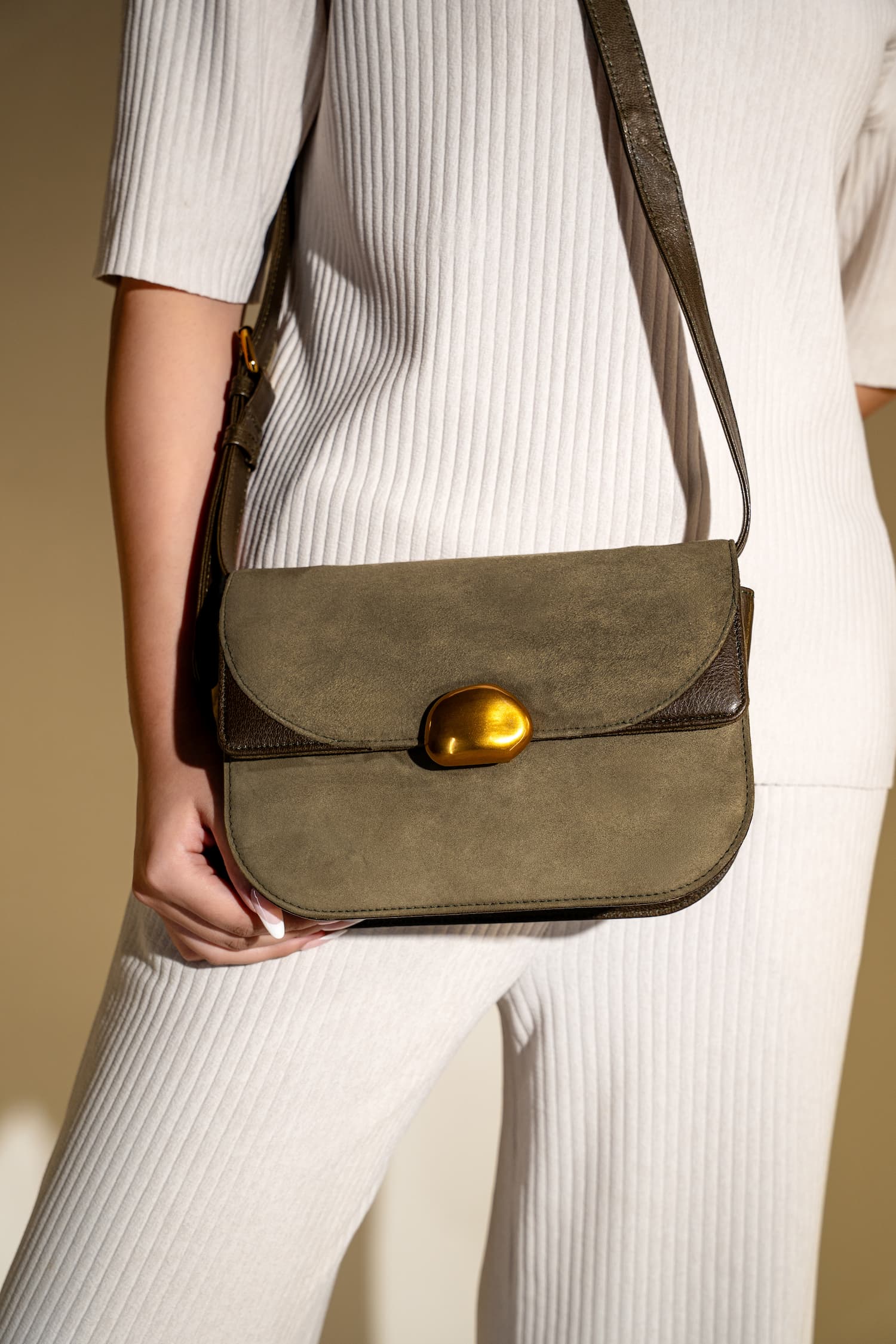 Womens suede & leather crossbody shoulder bag in olive green colour with adjustabl shoulder strap and unqiue metallic gold push lock by JULKE
