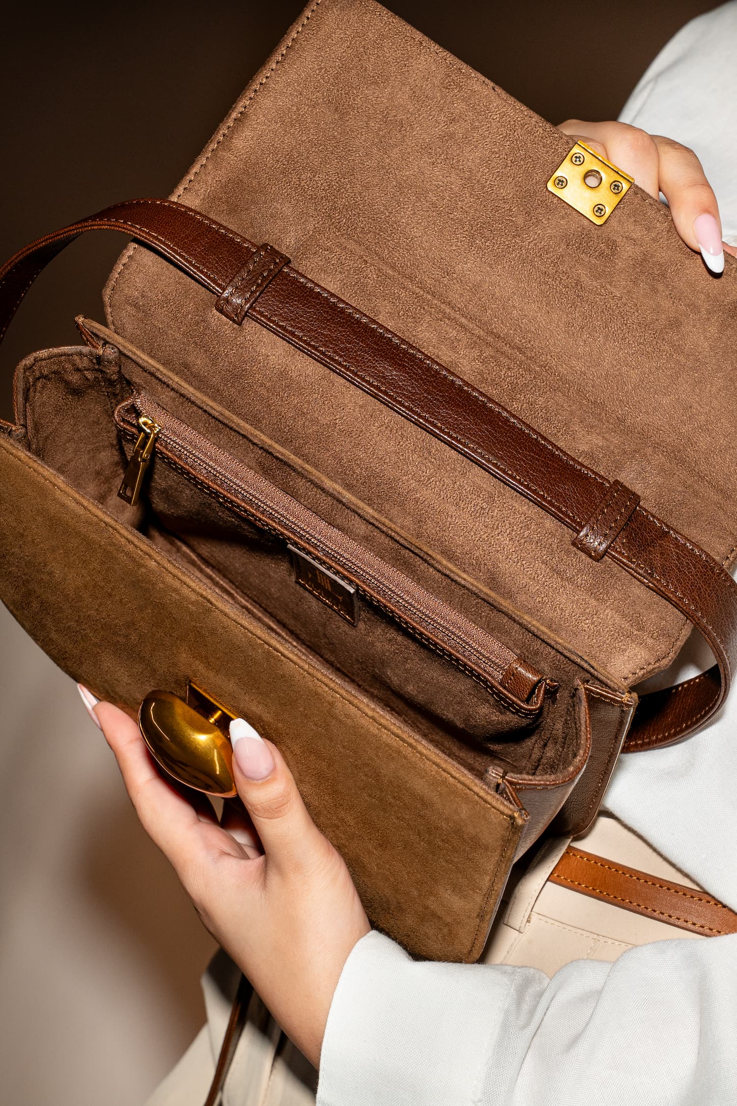 Womens suede & leather crossbody shoulder bag in brown colour with adjustabl shoulder strap and unqiue metallic gold push lock by JULKE