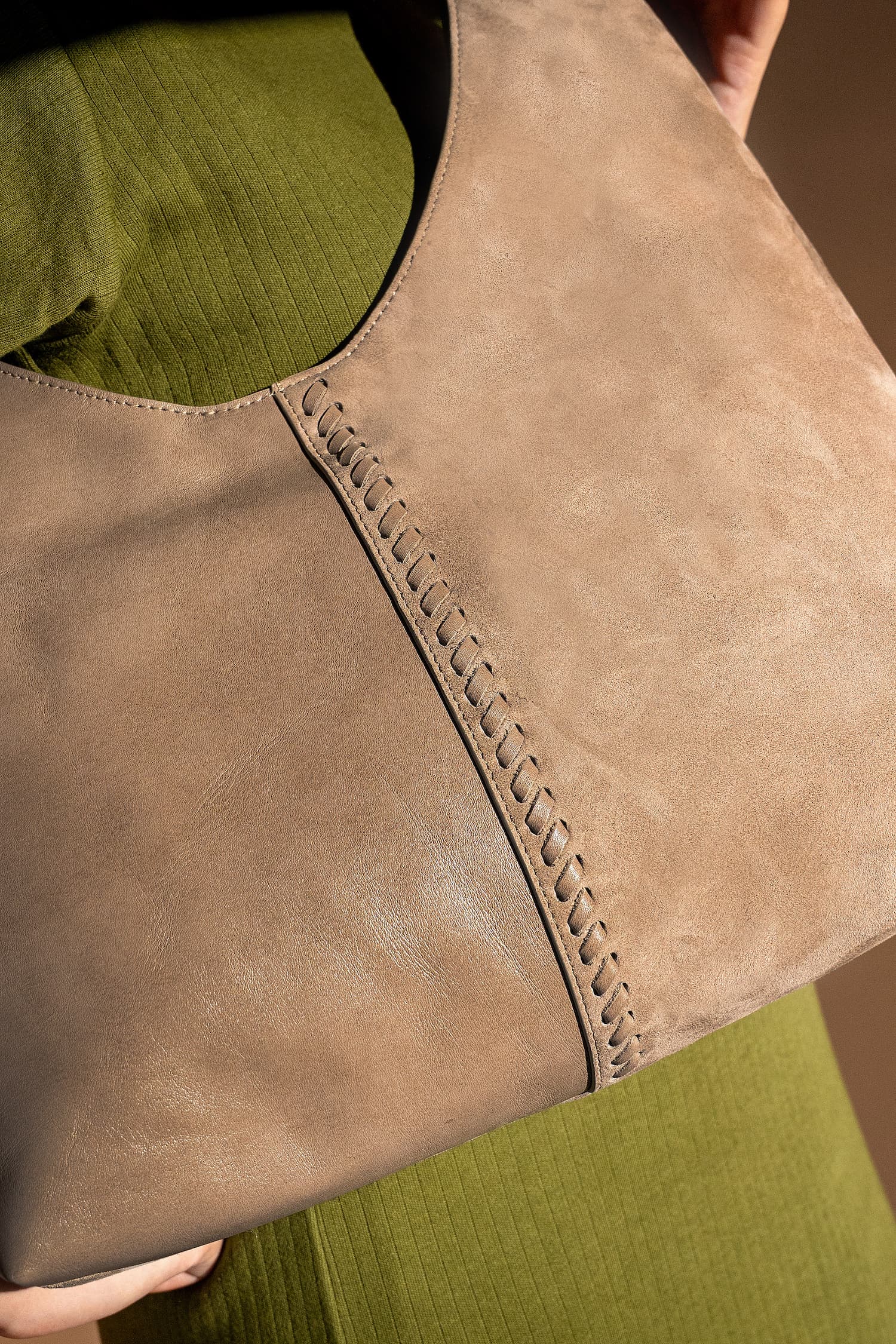 Women's leather hobo shoulder bag in grey brown colour with metallic gold chain shoulder strap and woven front panels by JULKE