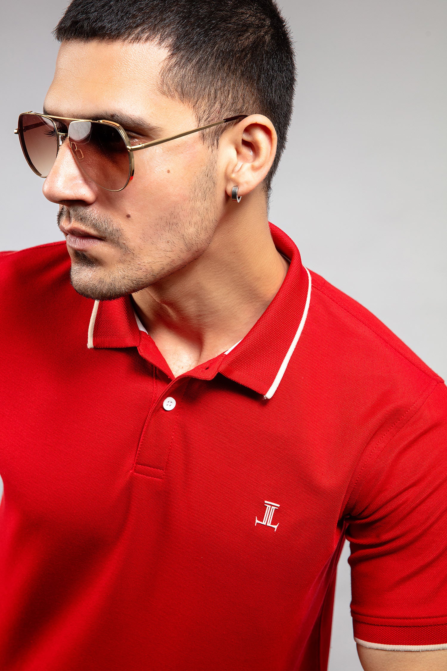 Mens summer polo shirt in red colour with matching white outline tipped collar and half sleeves by JULKE.