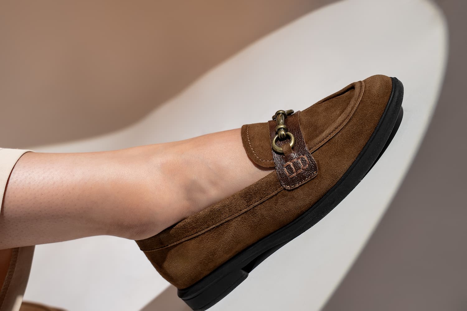 Womens suede leather loafers in brown colour with block heel and metallic gold buckle by JULKE.