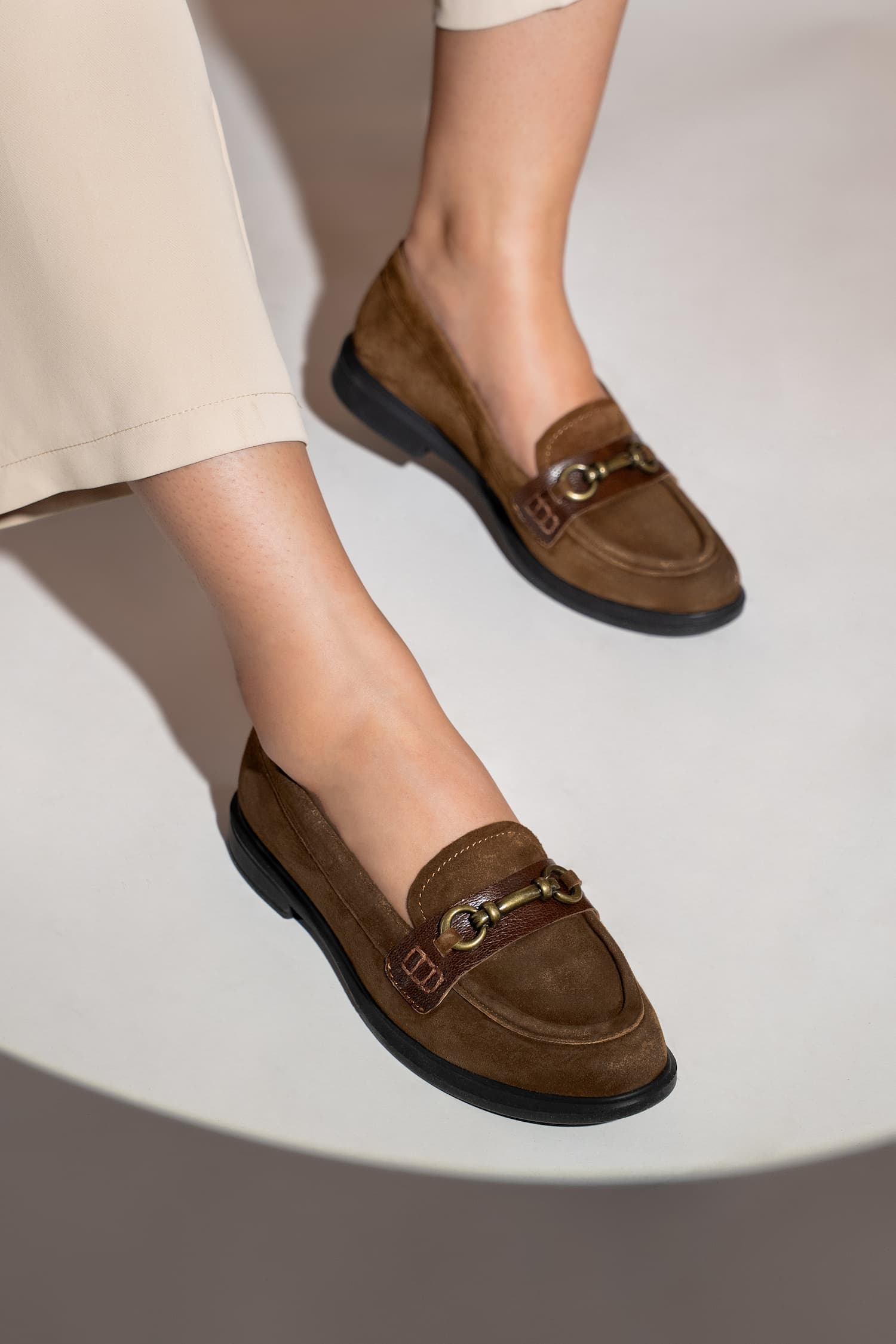 Womens suede leather loafers in brown colour with block heel and metallic gold buckle by JULKE.