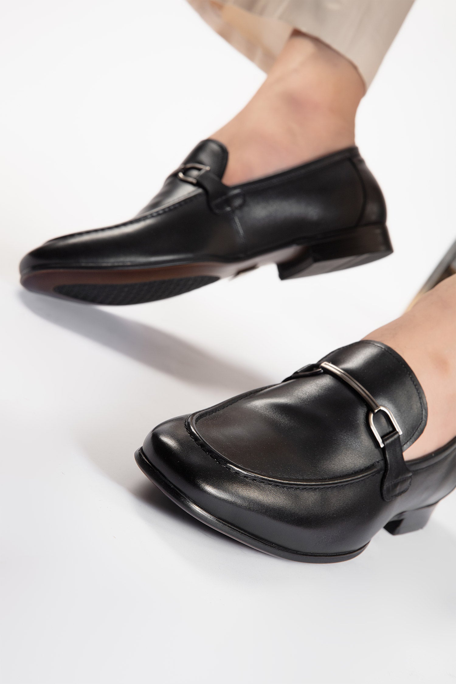 Mens leather slip on shoes in black colour with metal double bar buckle by JULKE