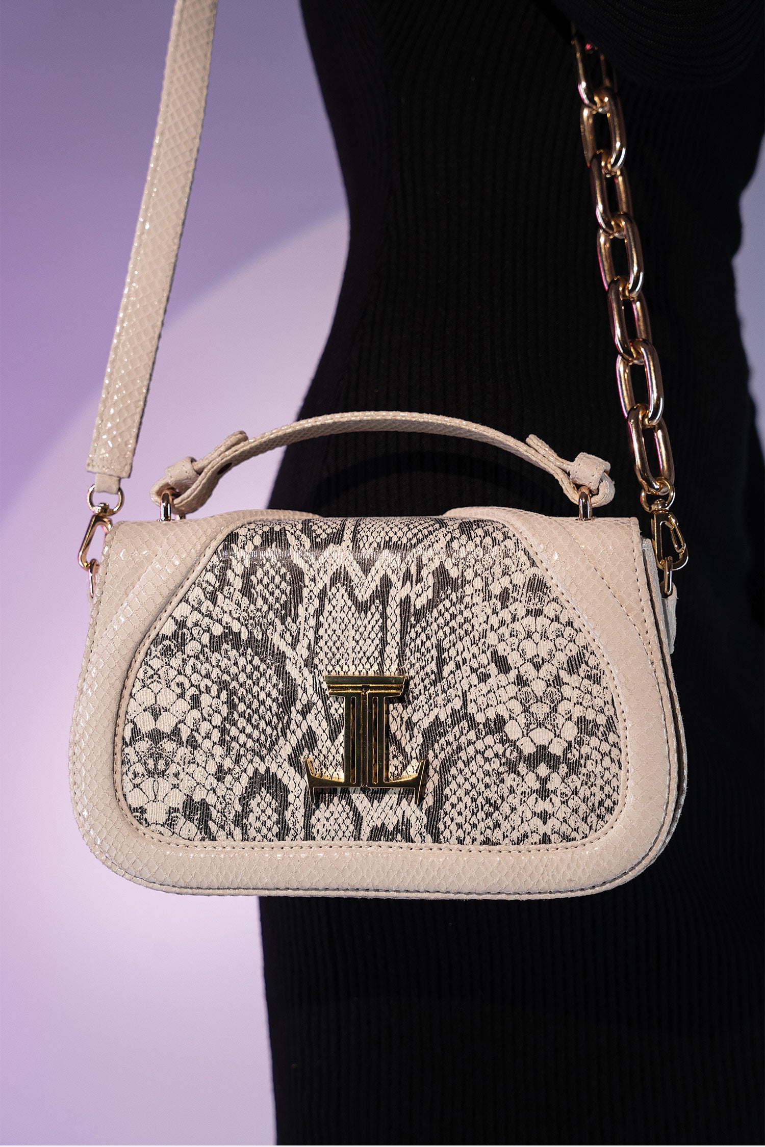 Women's leather top handle shoulder bag in white colour with snake print & texture by JULKE