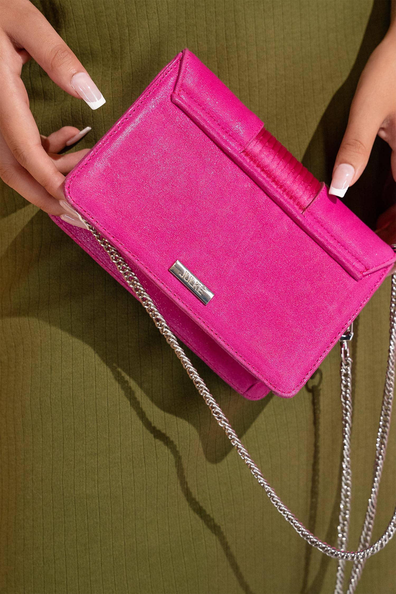 Women's suede leather clutch bag in shiny pink colour with satin pleated flap and geometric transparent rhinestone brooch by JULKE.