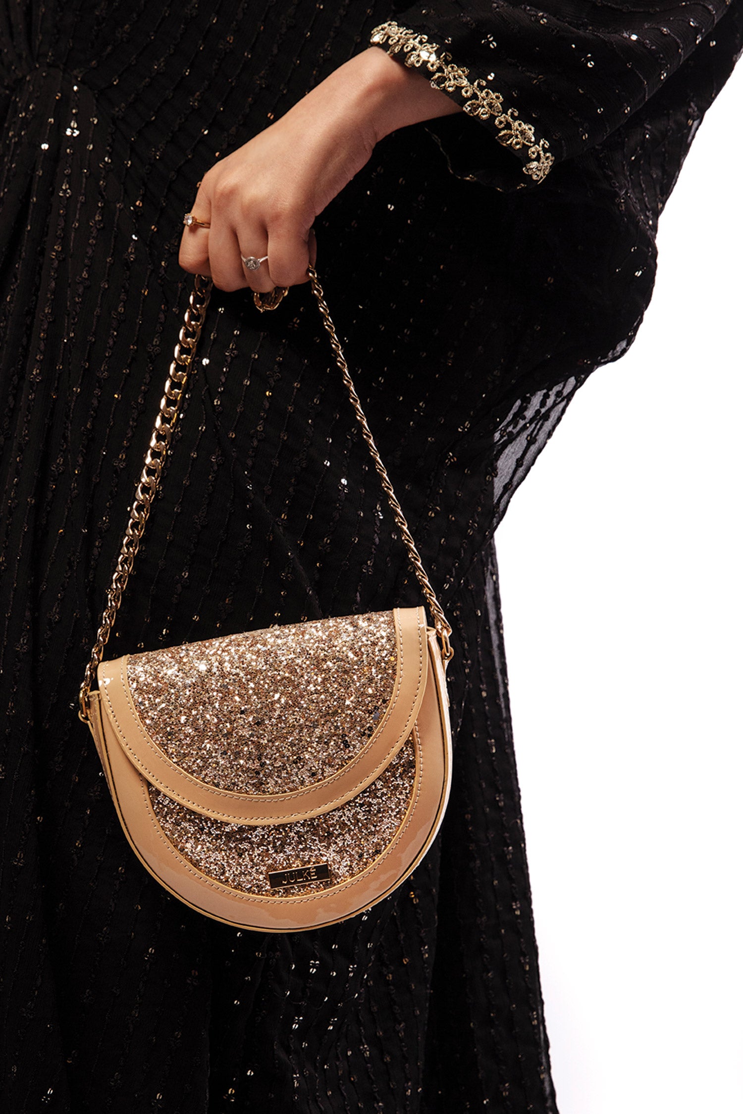 Womens leather round shoulder bag in beige colour with glitter, glossy patent and gold chain by JULKE