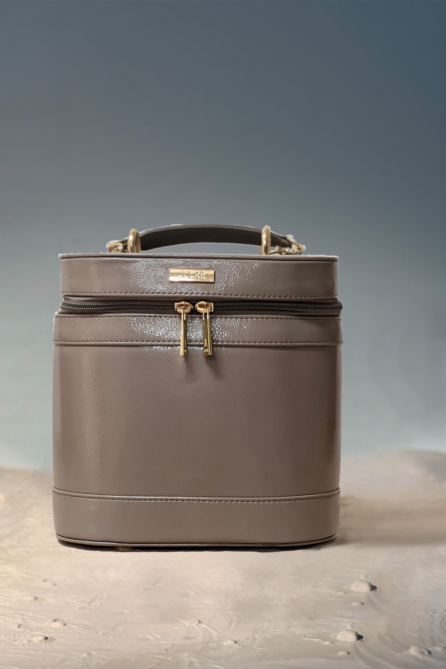 Women's leather cosmetics vanity trunk in grey colour with gold metallic chain handle by JULKE