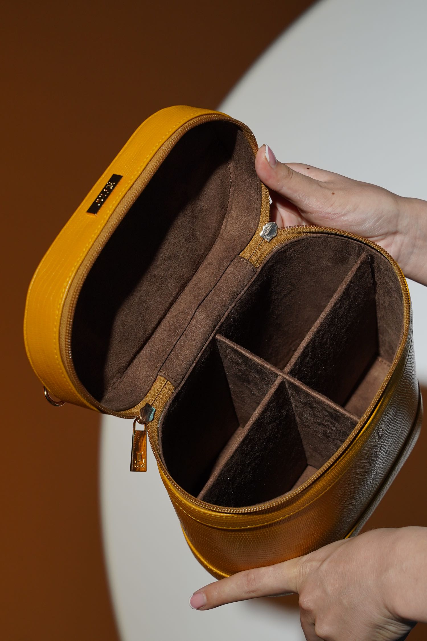 Women's leather cosmetics vanity trunk in mustard yellow colour with gold metallic chain handle by JULKE