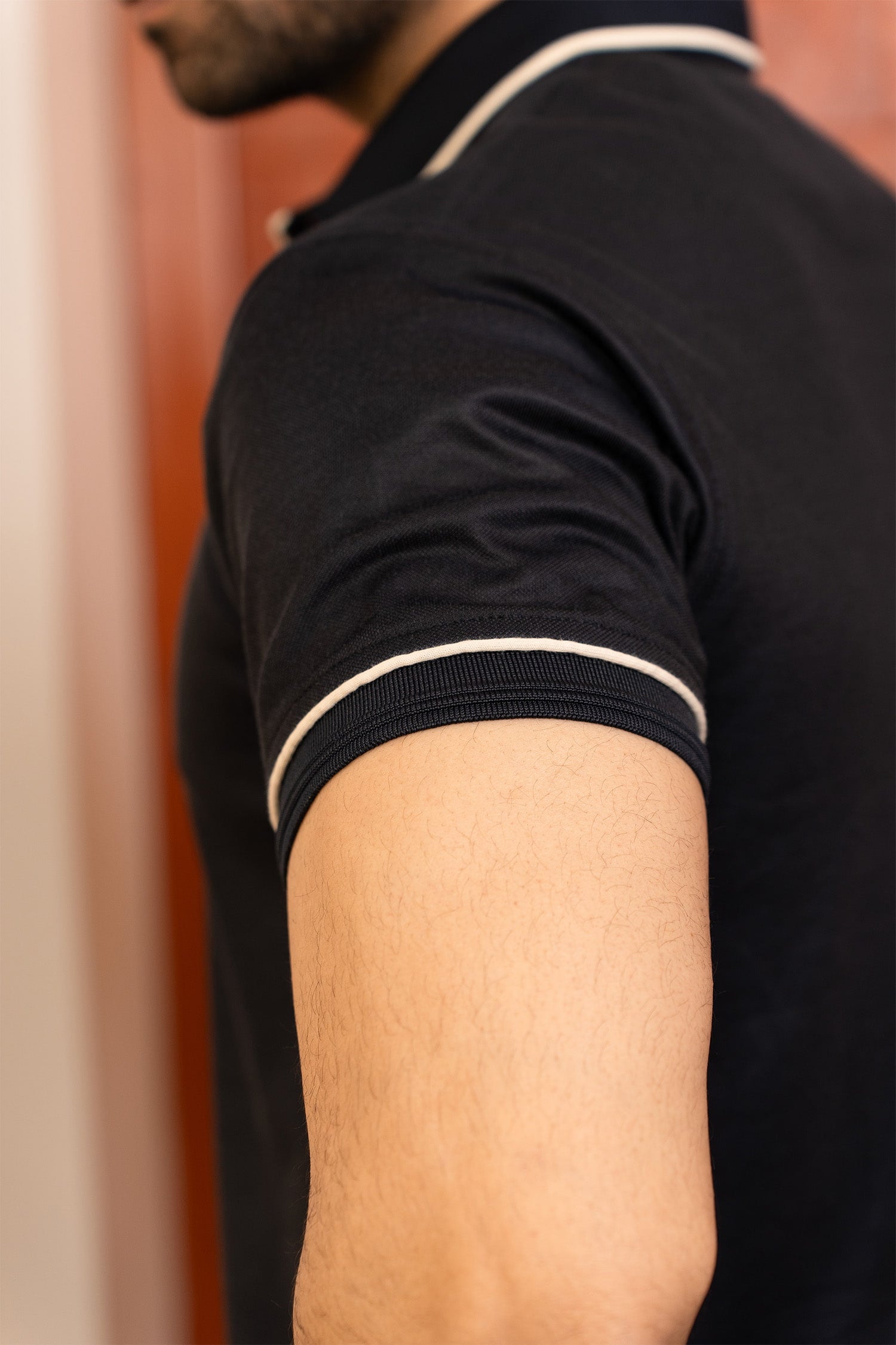 Mens half sleeve polo shirt in black colour with white buttons and white contrast tipping at collar placket and sleeves by JULKE.