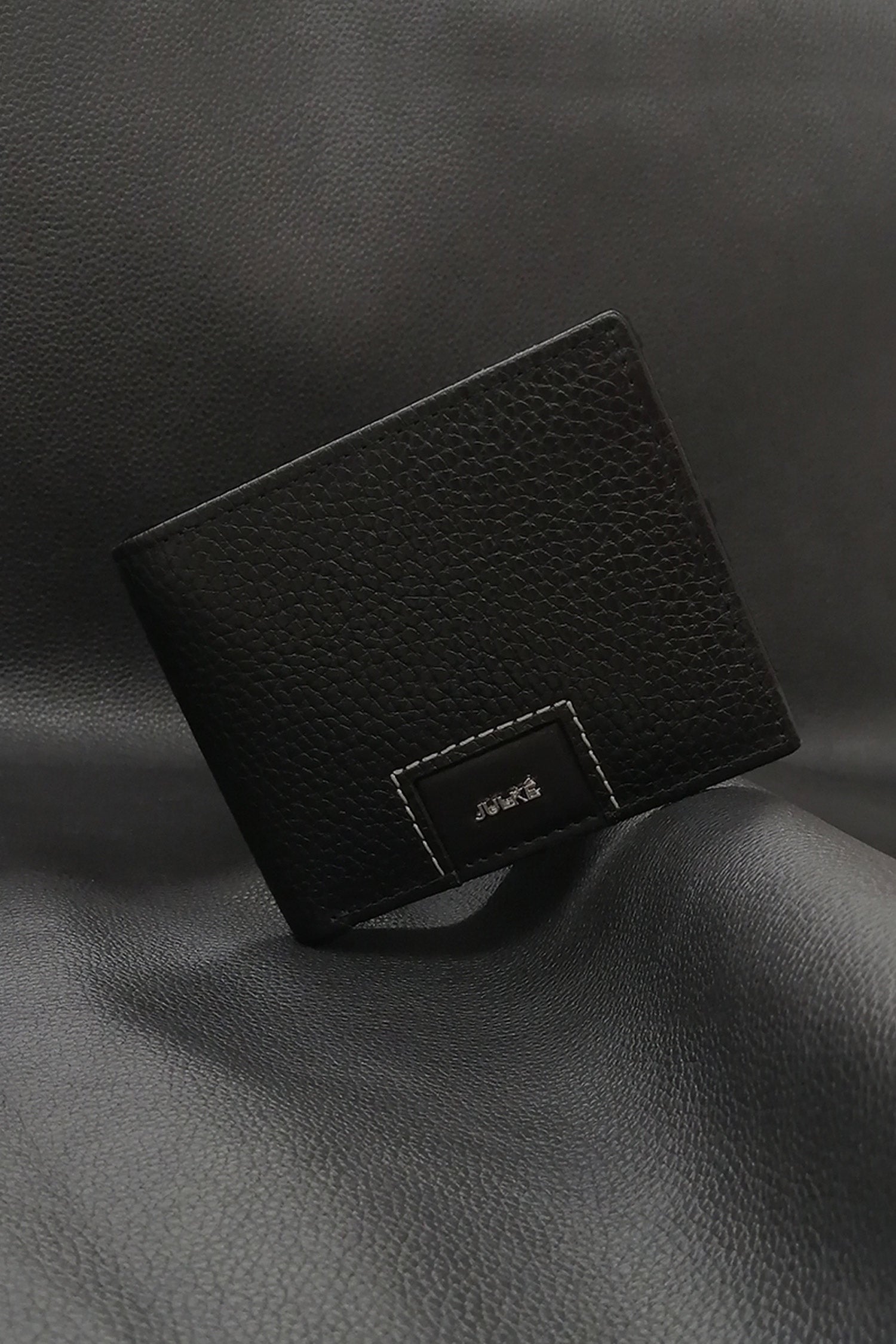 Mens leather bifold wallet in black colour with croc texture and white contrast stitch by JULKE