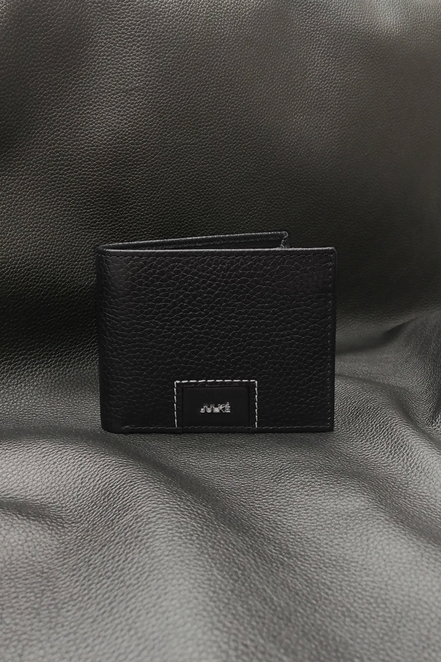 Mens leather bifold wallet in black colour with croc texture and white contrast stitch by JULKE