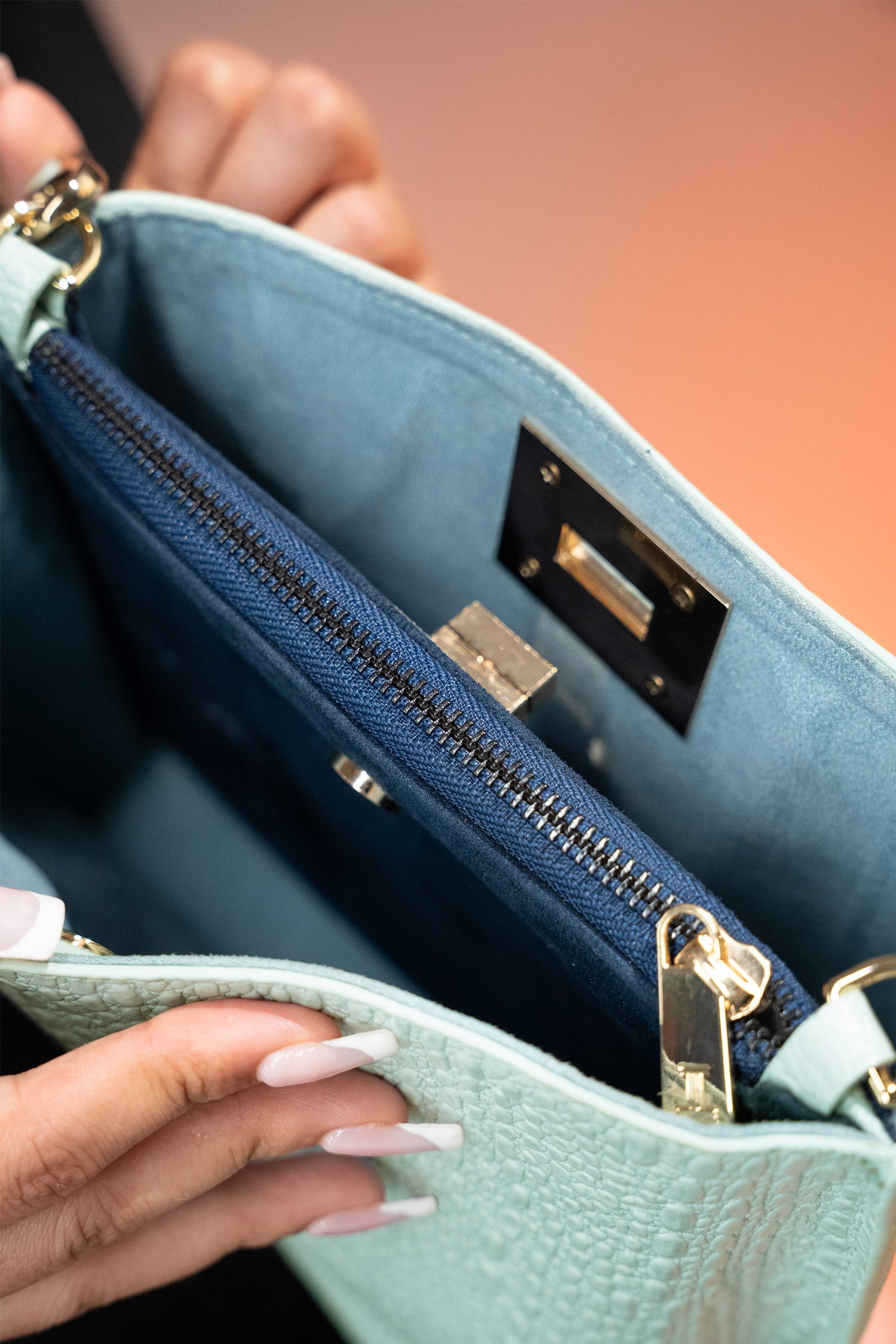 Women's leather bucket bag in mint blue colour with 3D texture and detachable shoulder strap by JULKE