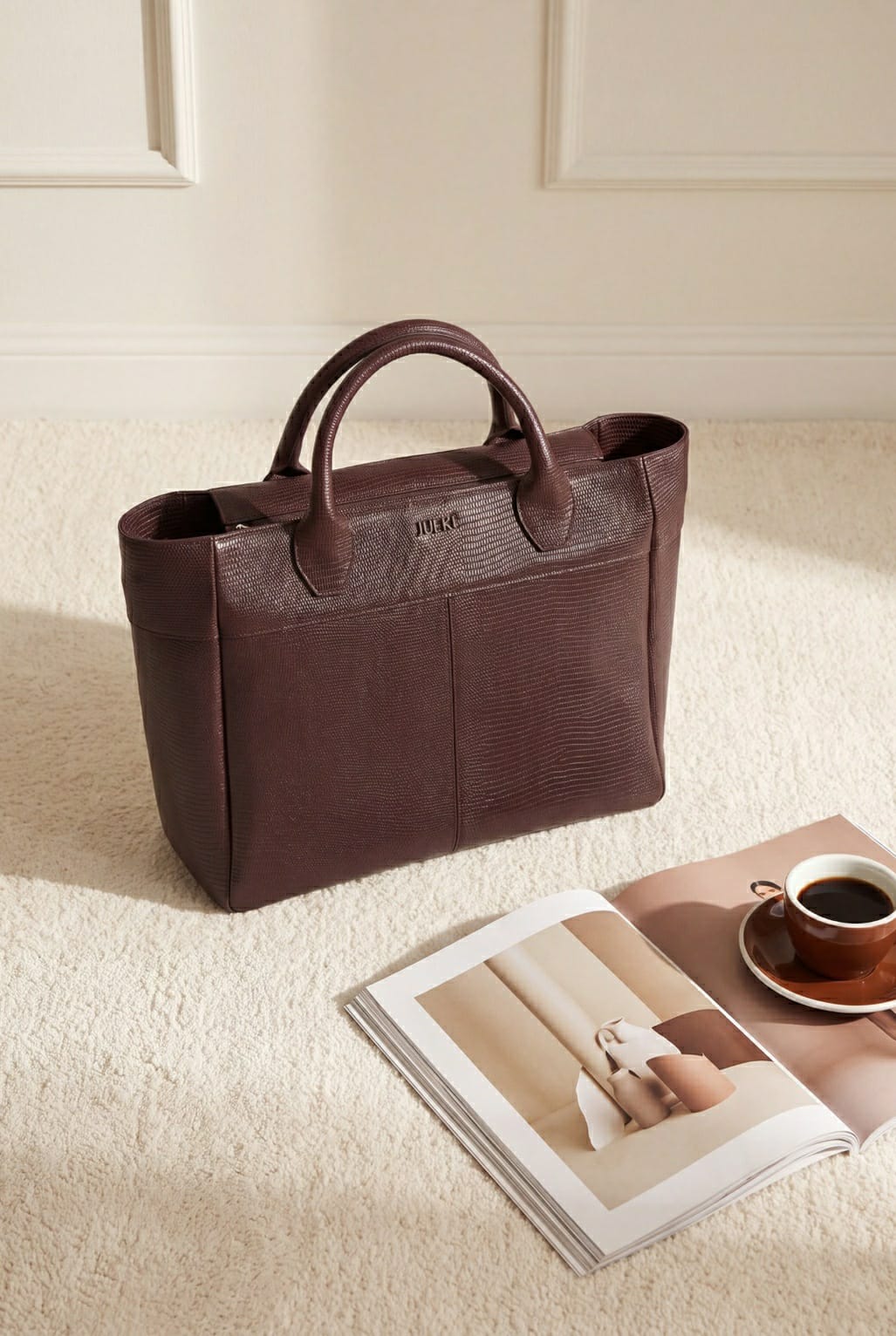 JULKE Carryall Maroon Textured Leather Tote Bag Lifestyle Shot with Magazine