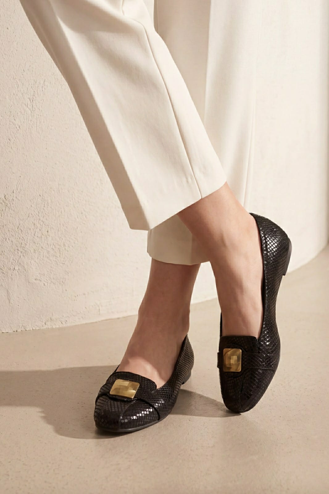 JULKÉ Lucan women moccasin in black worn with cream trousers - on-foot view