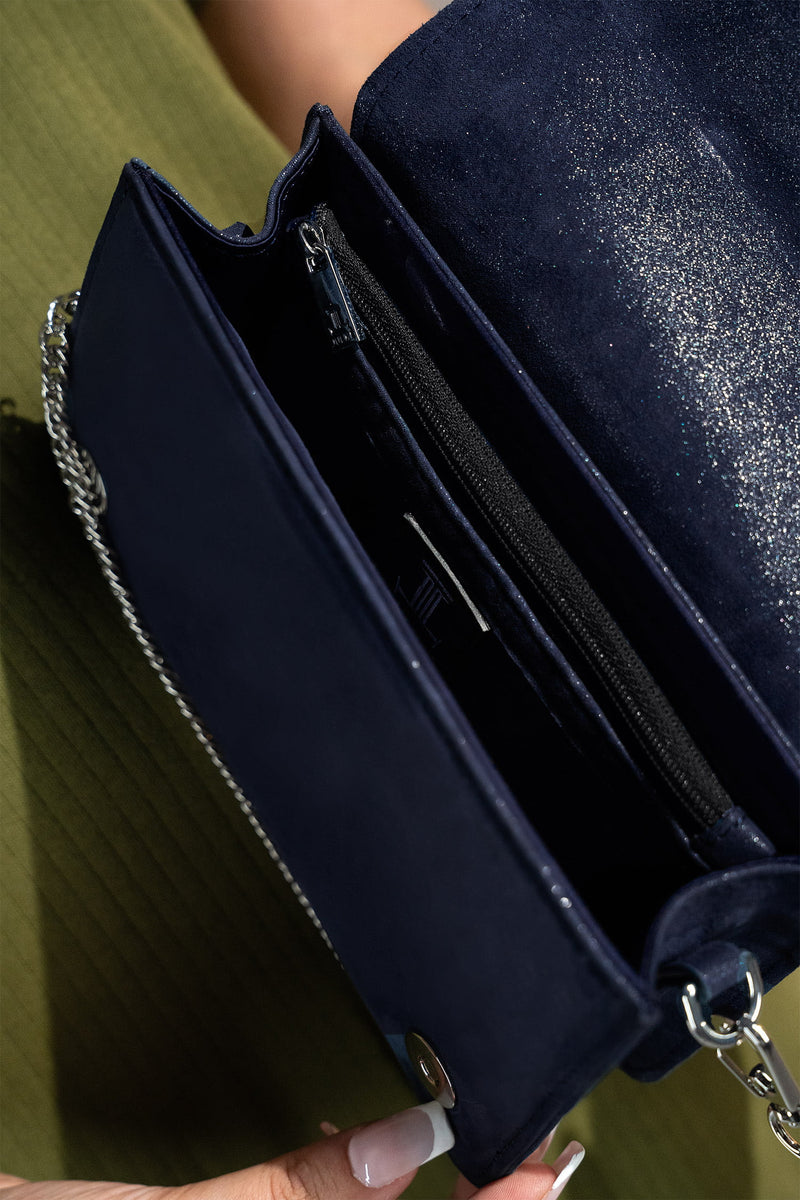 Womens leather shoulder clutch bag in dark blue colour with satin piping and rhinestone brooch by JULKE. 