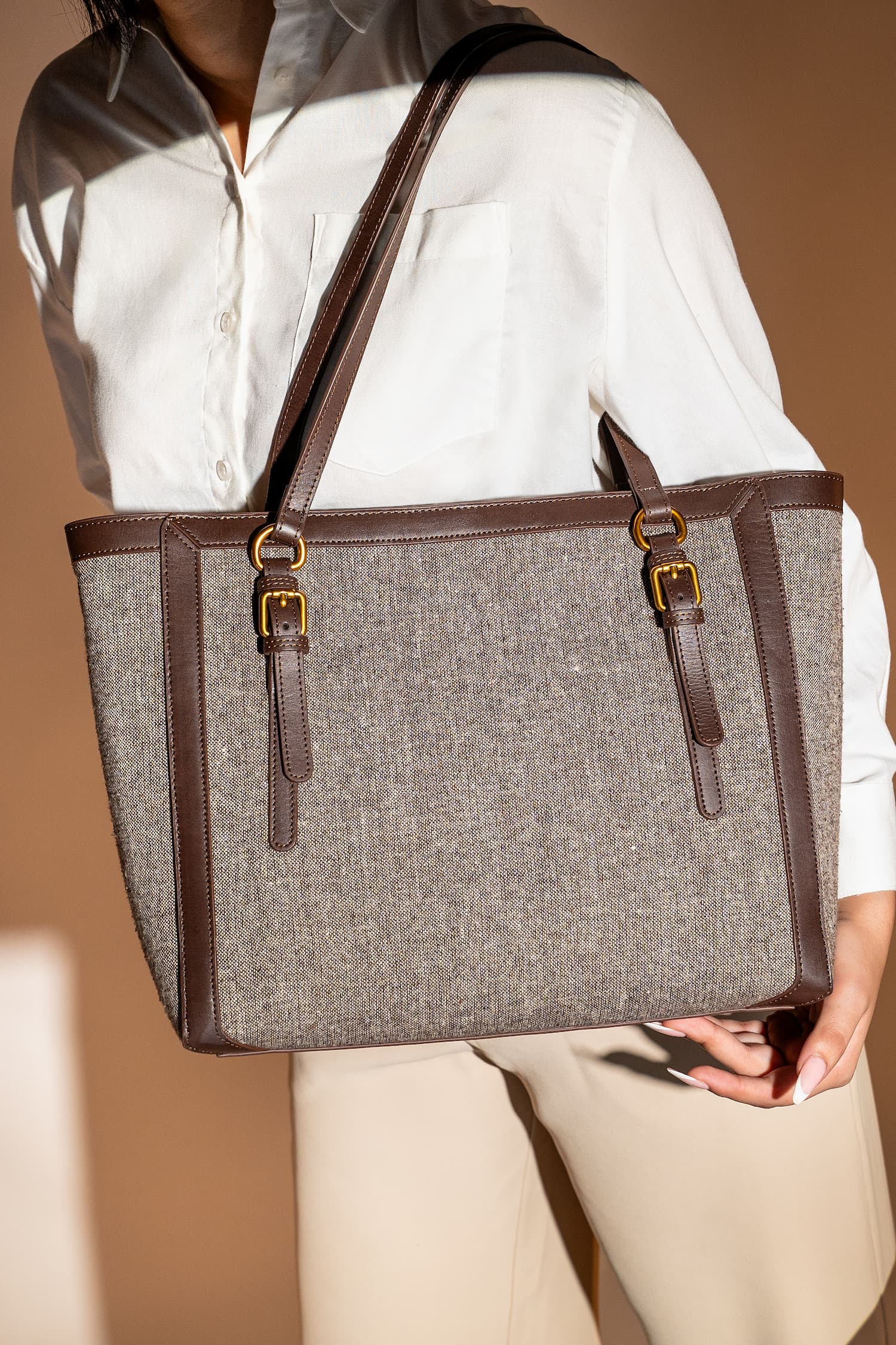 Women's leather & tweed shoulder tote bag in brown colour with removable inner suede pouch and metallic gold hardware by JULKE. 