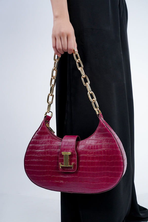 Womens leather shoulder baguette bag with croco texture and  gold chain in maroon colour by JULKE