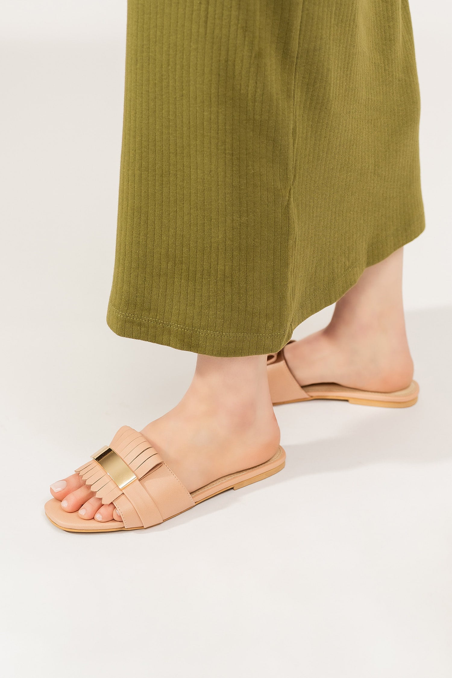 Womens leather flat shoes in light pink colour with matching fringe and metallic gold leather strap by JULKE. 