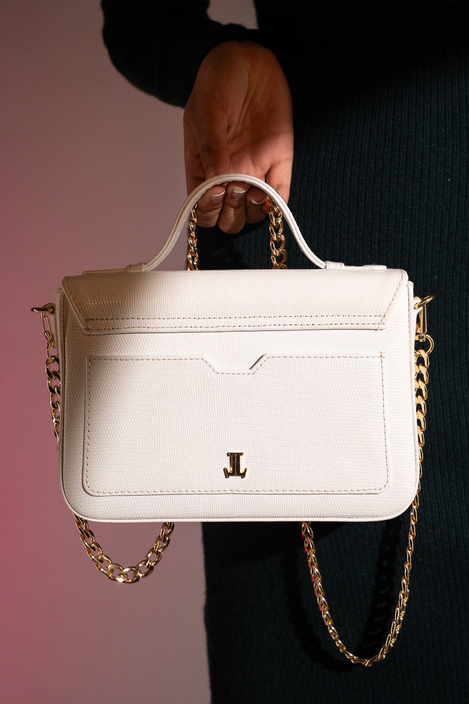 Women's leather top handle shoulder bag in white reptile texture with metal wood and metallic gold chain strap by JULKE