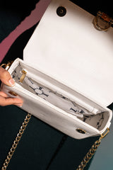 Women's leather top handle shoulder bag in white reptile texture with metal wood and metallic gold chain strap by JULKE