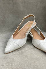 Women's kitten heels in white colour in reptile texture  with sling-back and pointed toe by JULKE