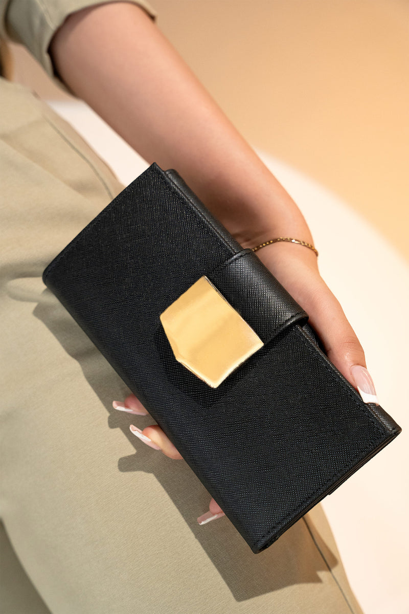 Women's leather long wallet in black colour in crosshatch texture with gold metal press button strap and extra pockets by JULKE. 