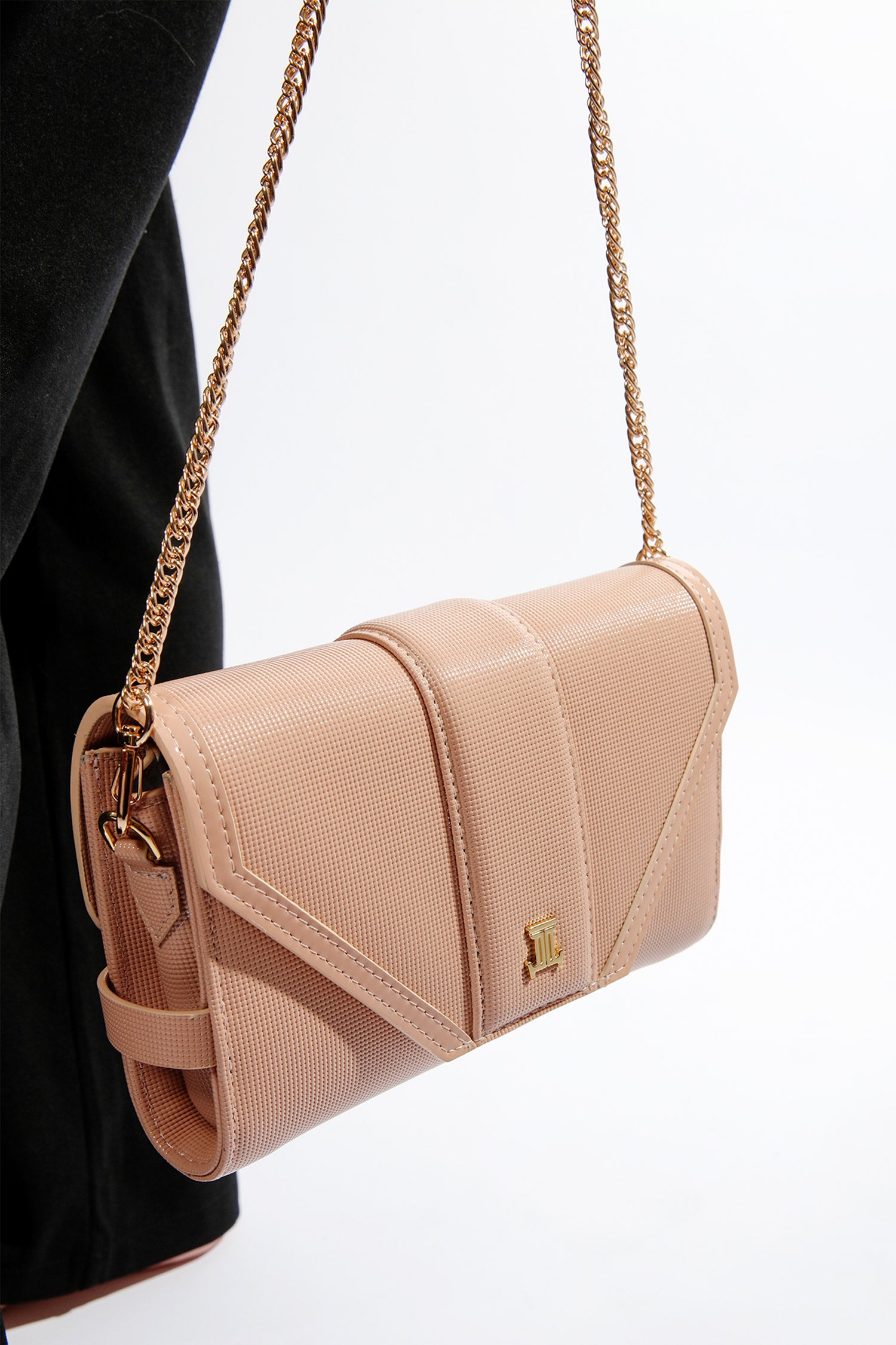 Womens leather shoulder bag clutch in light pink colour with gold chain and buckles by JULKE