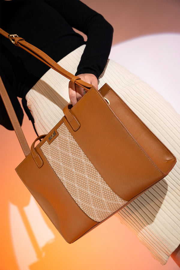 Women's leather tote bag medium size in brown colour with diamond pattern fabric strip and detachable shoulder strap by JULKE. 