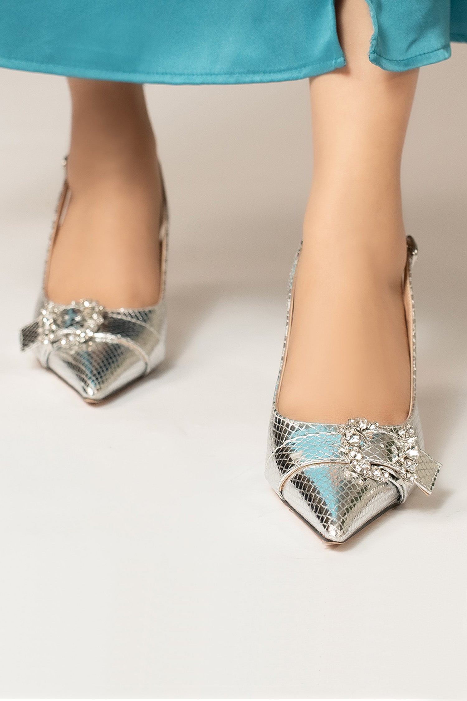 Womens slingback pointed toe heels in silver colour with metallic reptile texture and diamante buckle by JULKE. 