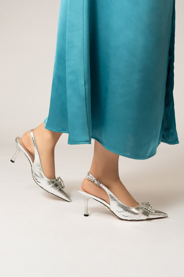 Womens slingback pointed toe heels in silver colour with metallic reptile texture and diamante buckle by JULKE. 