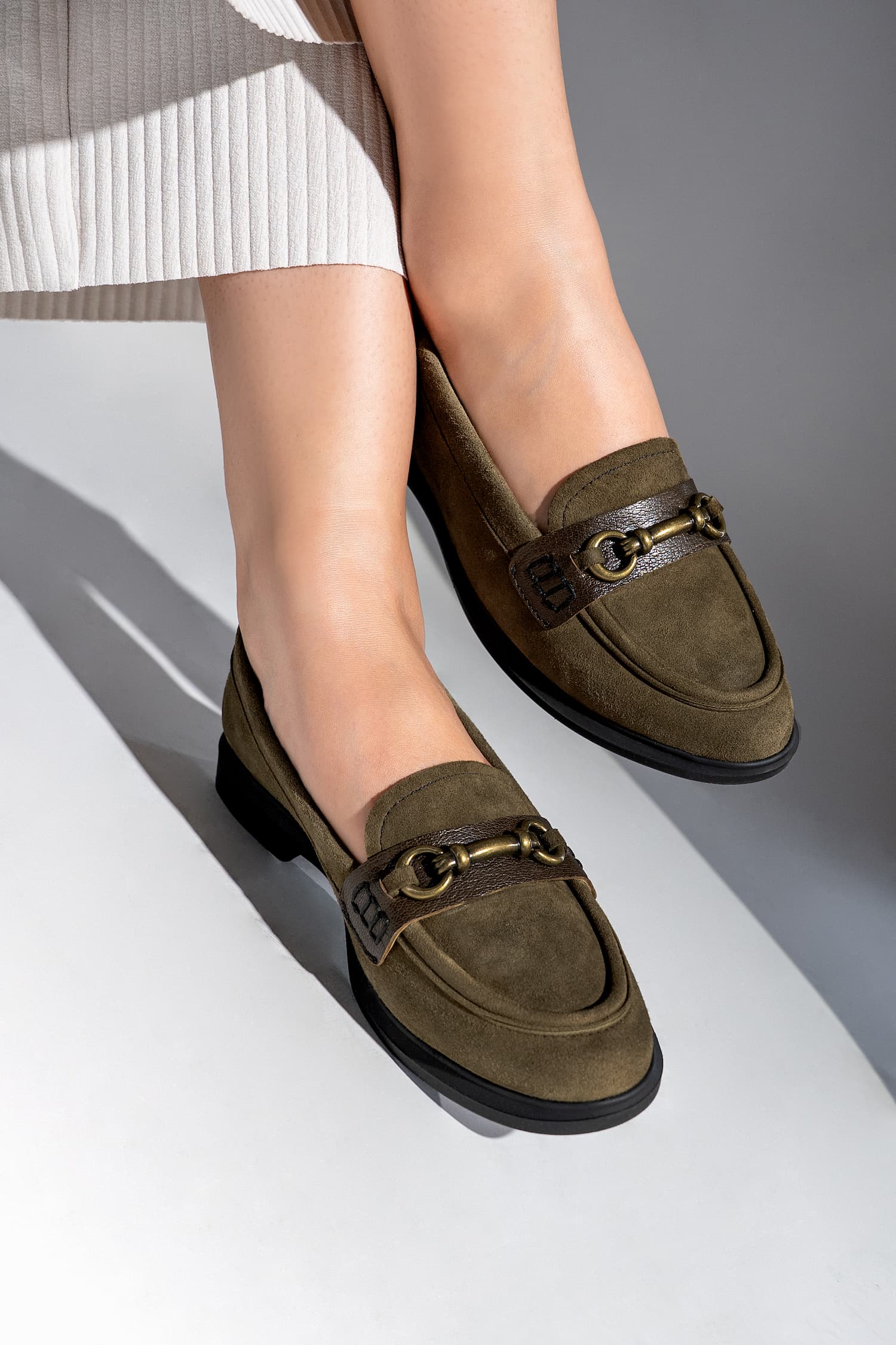 Womens suede leather loafers in olive green colour with block heel and metallic gold buckle by JULKE