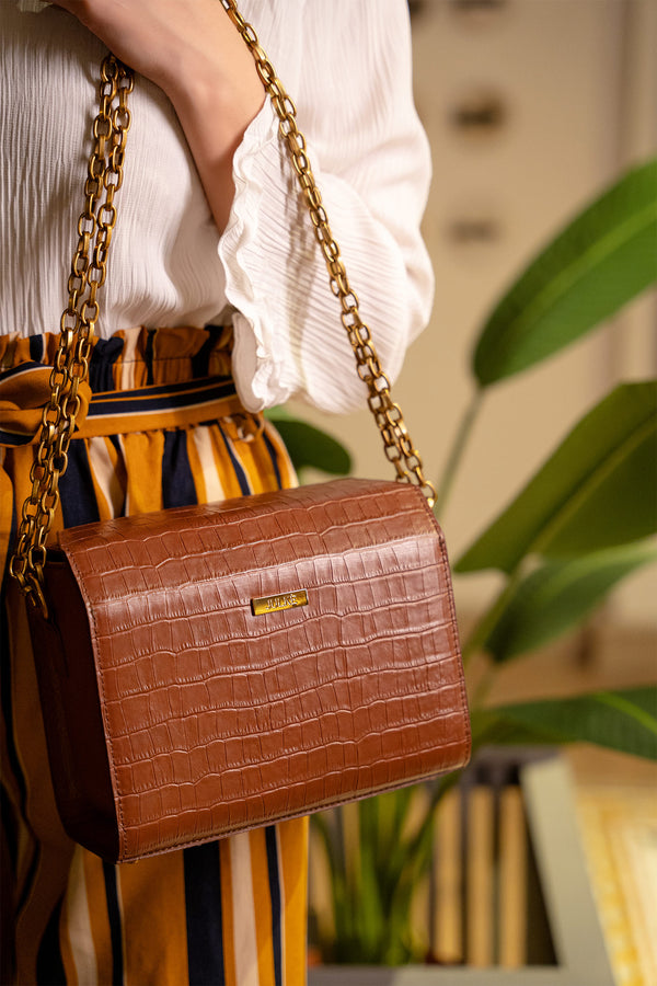 Womens leather shoulder bag in brown colour with croc texture and gold chain by JULKE