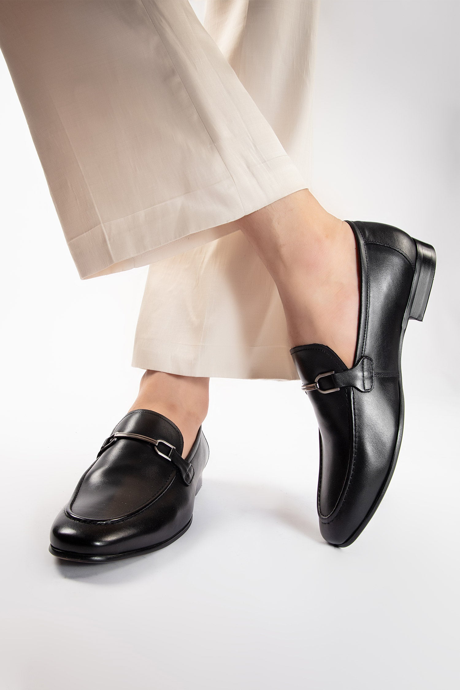 Mens leather slip on shoes in black colour with metal double bar buckle by JULKE