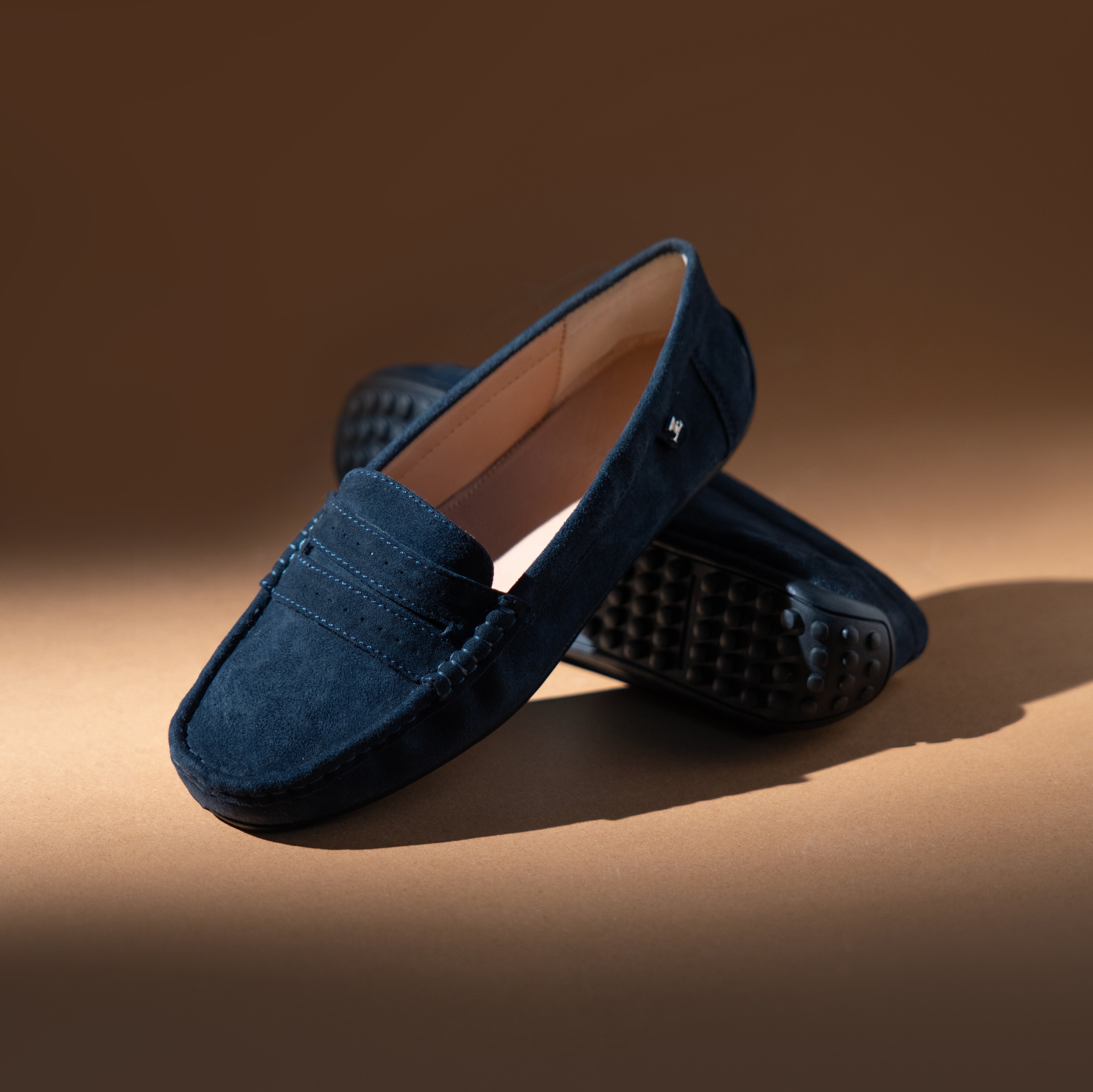Women's winter suede leather moccasins in dark blue colour with metal logo trim and moc toe by JULKE 