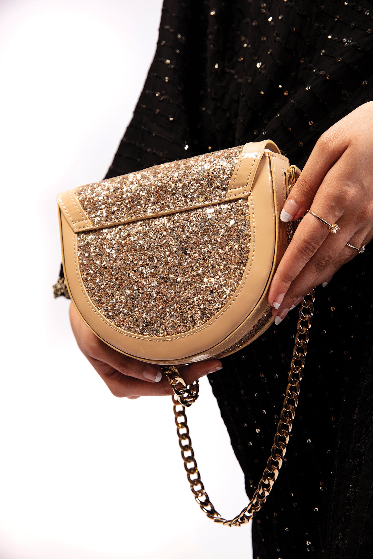 Womens leather round shoulder bag in beige colour with glitter, glossy patent and gold chain by JULKE 