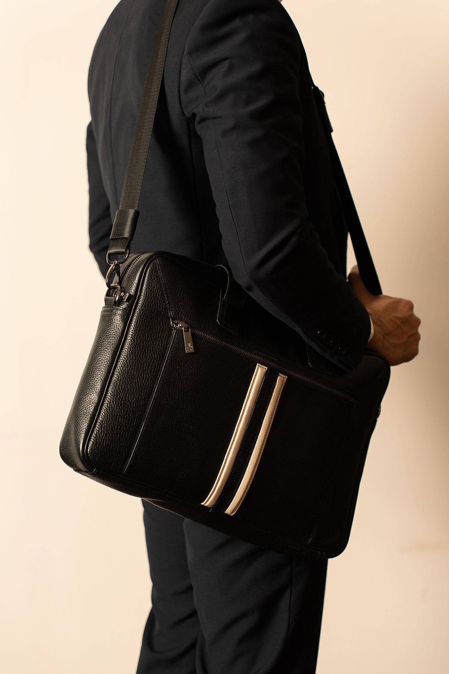 Mens soft leather laptop bag in black colour with off white leather stripe in front and metallic grey hardware by JULKE.
