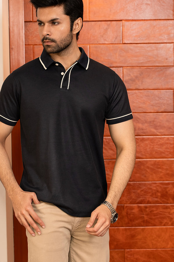 Mens half sleeve polo shirt in black colour with white buttons and white contrast tipping at collar placket and sleeves by JULKE. 