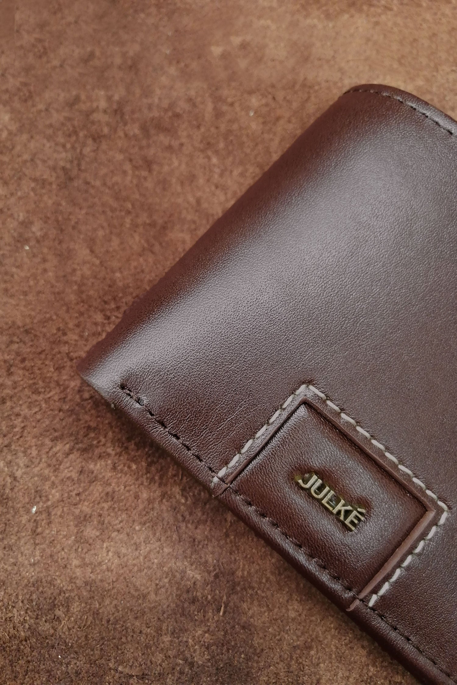 Mens leather bifold wallet in dark brown colour with contrast stitching and gold metallic brand trims by JULKE