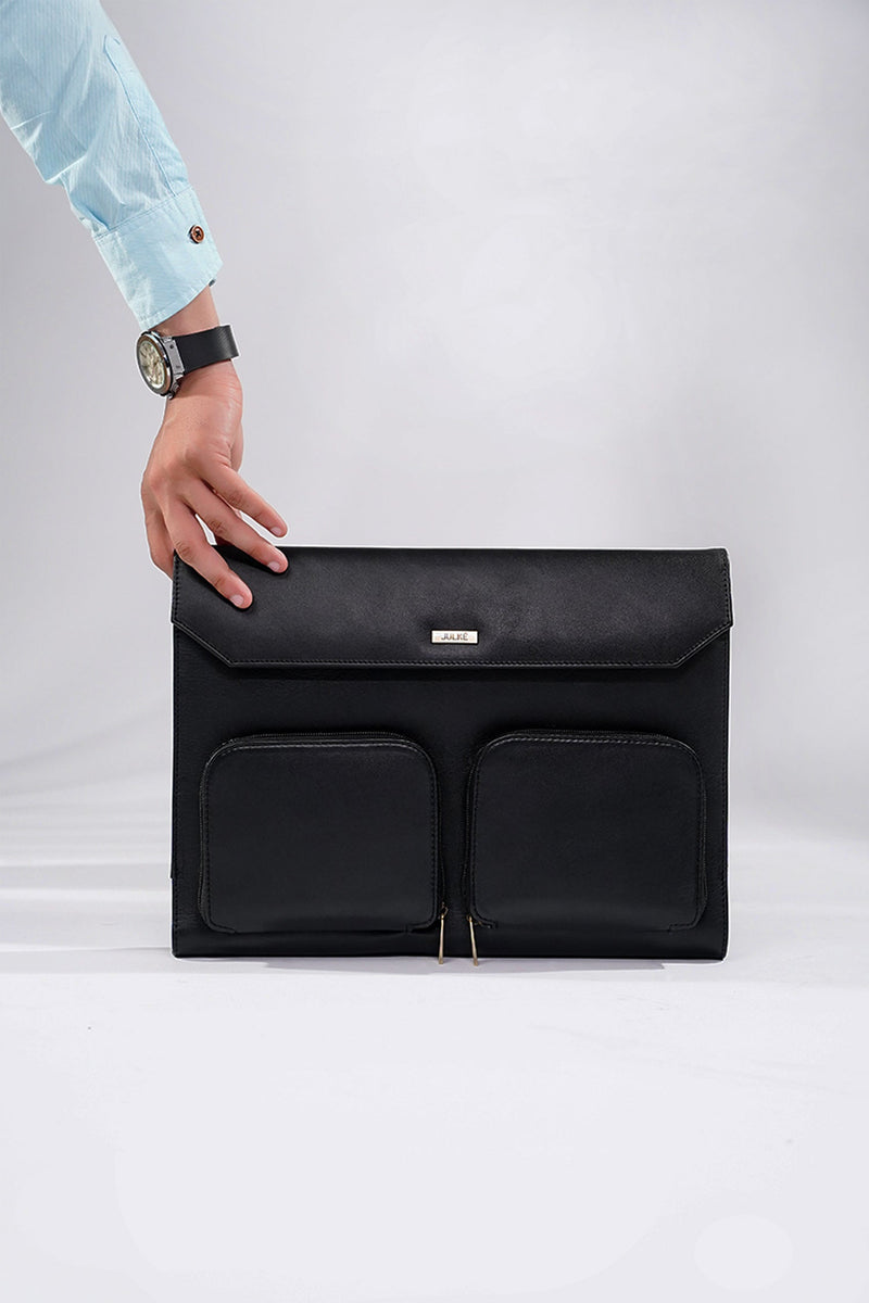 Leather laptop sleeve in black colour with front pockets by JULKE