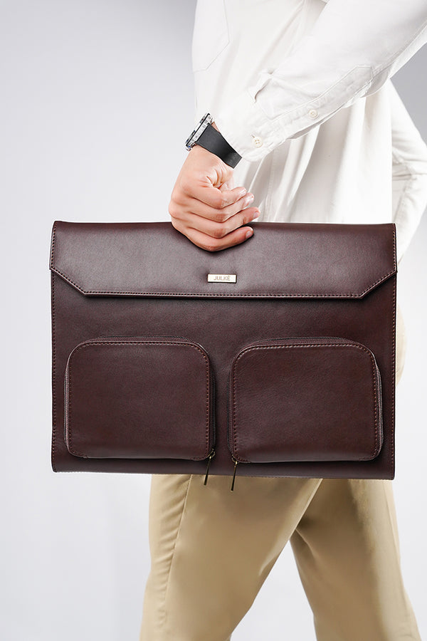 Leather laptop sleeve in dark brown colour with front pockets by JULKE