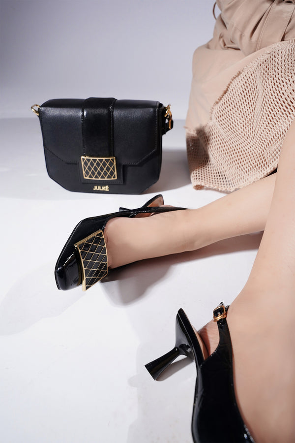 Women slingback heels in black colour with gold and black buckle by JULKE