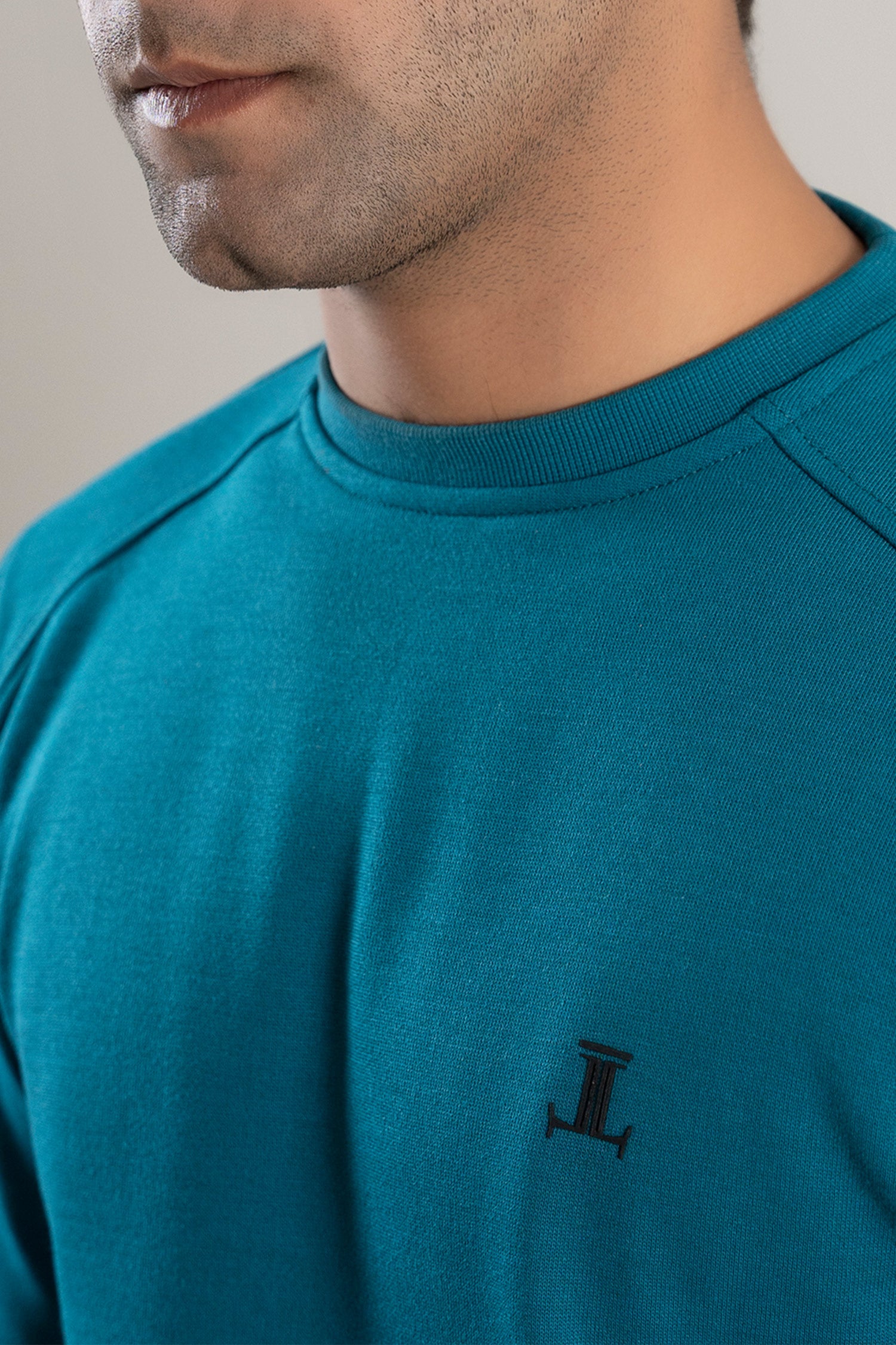 Mens winter sweatshirt in turquoise blue colour with fleece lining by JULKE. 