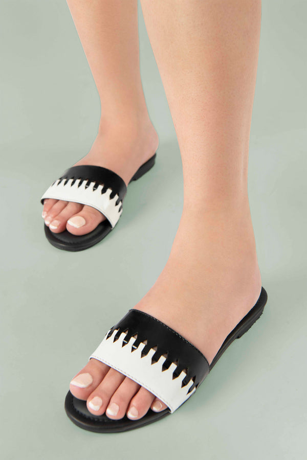 Women summer flat shoes in black and white colour with weaving by JULKE