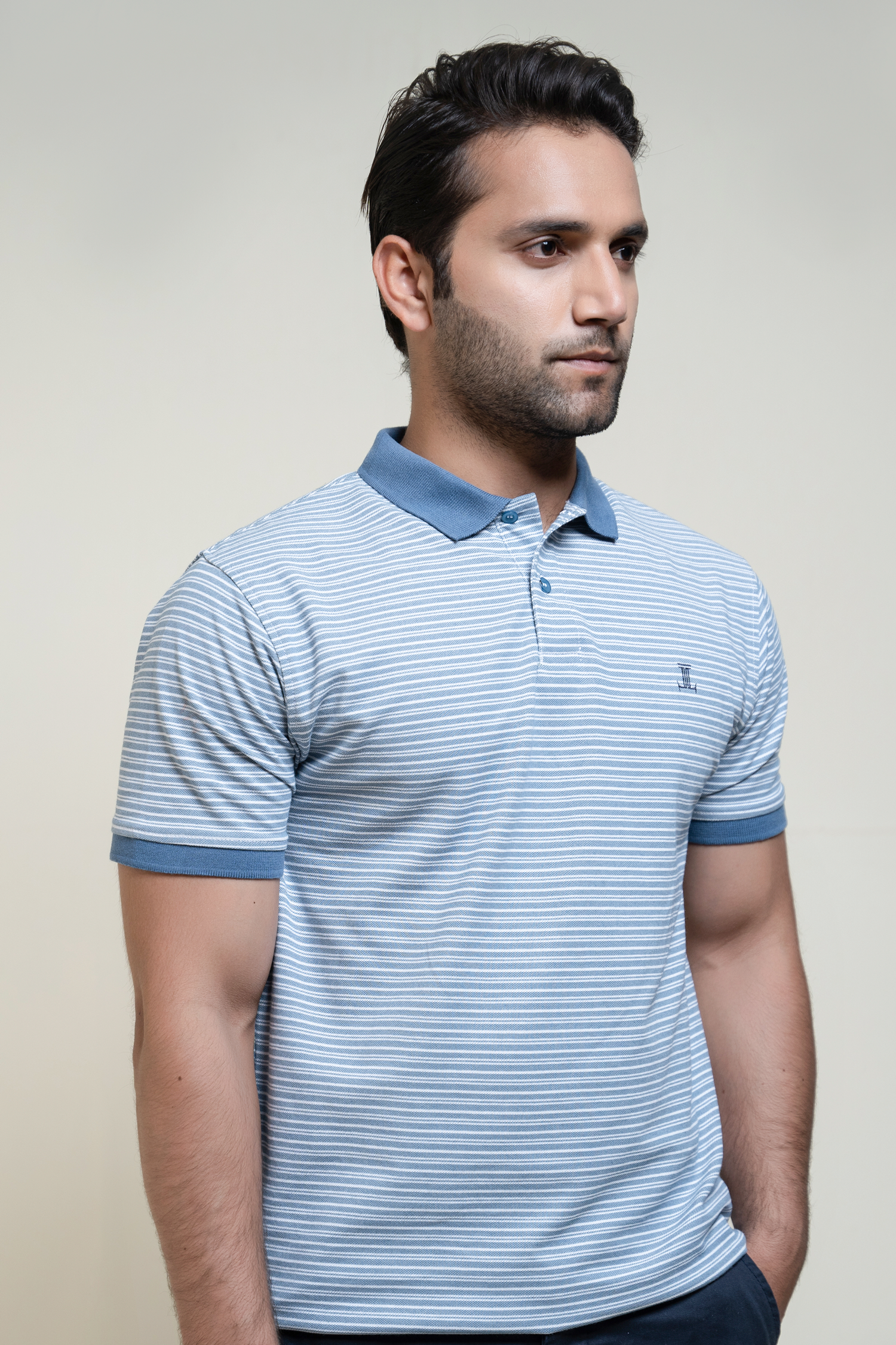 Mens striped polo shirt in light blue colour with blue collar and sleeve tips by JULKE. 